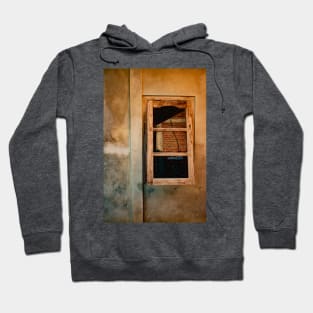 Wooden window on yellow brown grained plastered wall. Hoodie